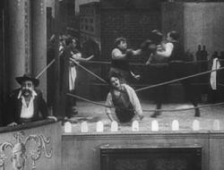 Chaplin gets hung up on the ropes in The Knockout. Chaplin gets hung up on the ropes in The Knockout.