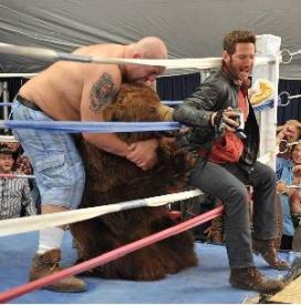 Paul (The Big Show) Wight, a man in a bear costume, and Mark Feuerstein.