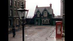 Katie Johnson as Mrs. Wilburforce enters her home in The Ladykillers.