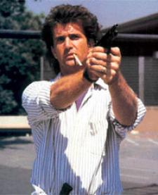 Mel Gibson as the long haired Martin Riggs. Mel Gibson as the long haired Martin Riggs.