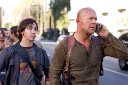 Justin Long and Bruce Willis in Live Free or Die Hard. Justin Long and Bruce Willis in Live Free or Die Hard.