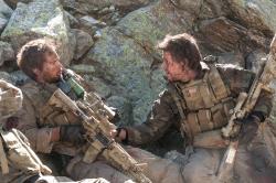 Taylor Kitsch and Mark Wahlberg in Lone Survivor. Taylor Kitsch and Mark Wahlberg in Lone Survivor.