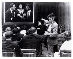 Mack Sennett and Fatty Arbuckle in the audience while Mabel Normand is on the big screen. Mack Sennett and Fatty Arbuckle in the audience while Mabel Normand is on the big screen.