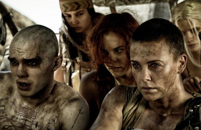 Nicholas Hoult and Charlize Theron in Mad Max: Fury Road. Nicholas Hoult and Charlize Theron in Mad Max: Fury Road.