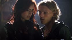 Lily Collins and Jamie Campbell Bower in The Mortal Instruments: City of Bones. Lily Collins and Jamie Campbell Bower in The Mortal Instruments: City of Bones.