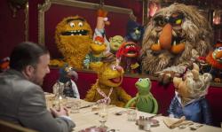 Ricky Gervais and the Muppets in Muppets Most Wanted.