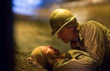 Charlize Theron and Jeremy Renner in North Country. Charlize Theron and Jeremy Renner in North Country.