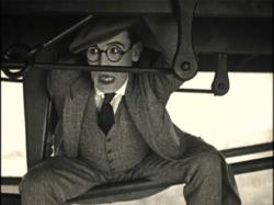 Harold Lloyd riding the rails in Now or Never