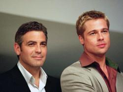 George Clooney and Brad Pitt in Ocean's Eleven. George Clooney and Brad Pitt in Ocean's Eleven.