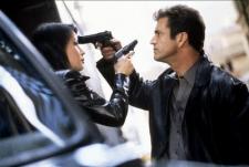 Lucy Liu getting turned on by Mel Gibsons gun.