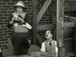 Edna Purviance and Charlie Chaplin in Pay Day.