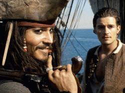 Johnny Depp and Orlando Bloom in Pirates of the Caribbean: The Curse of the Black Pearl.