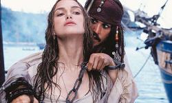 Keira Knightley and Johnny Depp in Pirates of the Caribbean: The Curse of the Black Pearl. Keira Knightley and Johnny Depp in Pirates of the Caribbean: The Curse of the Black Pearl.