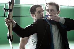 Guillaume Gouix teaches archery to Jean-Paul Rouve in Nobody Else But You.