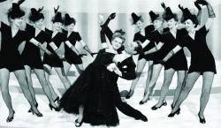 Judy Garland, Charles Walters, and chorus in Presenting Lily Mars. Judy Garland, Charles Walters, and chorus in Presenting Lily Mars.