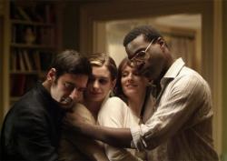 Best man, maid of honor, bride and groom share a group hug. Best man, maid of honor, bride and groom share a group hug.