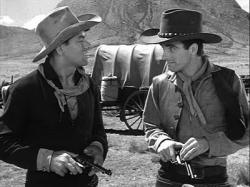 John Ireland and Montgomery Clift compare revolvers in Red River. John Ireland and Montgomery Clift compare revolvers in Red River.