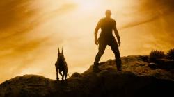 Vin Diesel and man's best friend in Riddick.