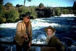 John Wayne and Katharine Hepburn in Rooster Cogburn. John Wayne and Katharine Hepburn in Rooster Cogburn.