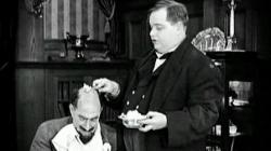 Fatty Arbuckle discovers a creative new use for butter in The Rough House Fatty Arbuckle discovers a creative new use for butter in The Rough House
