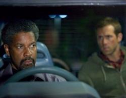 Denzel Washington schools Ryan Reynolds in Safe House. Denzel Washington schools Ryan Reynolds in Safe House.