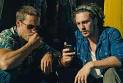 Taylor Kitsch and Aaron Taylor-Johnson in Savages.