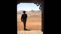 John Wayne in an iconic screen moment. John Wayne in an iconic screen moment.