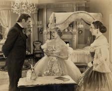 Mary Pickford wears an elaborate Adrian gown. Mary Pickford wears an elaborate Adrian gown.