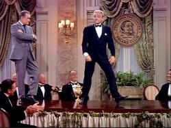 Bob Hope watches James Cagney dance in The Seven Little Foys. Bob Hope watches James Cagney dance in The Seven Little Foys.