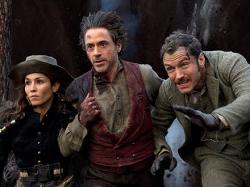 Noomi Rapace, Robert Downey Jr. and Jude Law in Sherlock Holmes: A Game of Shadows. Noomi Rapace, Robert Downey Jr. and Jude Law in Sherlock Holmes: A Game of Shadows.