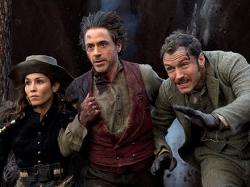 Noomi Rapace, Robert Downey Jr. and Jude Law in Sherlock Holmes: A Game of Shadows.