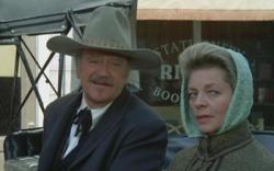 John Wayne and Lauren Bacall in The Shootist.