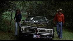 Sally Fields, the Pontiac Trans-Am and Burt Reynolds in Smokey and the Bandit.