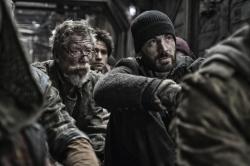 John Hurt and Chris Evans in Snowpiercer.