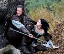 Chris Hemsworth and Kristen Stewart in Snow White and the Huntsman. Chris Hemsworth and Kristen Stewart in Snow White and the Huntsman.