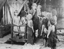 Mary Pickford as Mama Molly, hiding the children. Mary Pickford as Mama Molly, hiding the children.