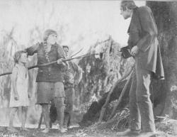 Mary Pickford defends the children from the evil Mr. Grimes in Sparrows.