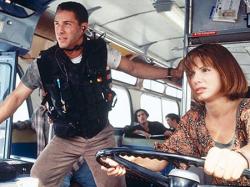 Keanu Reeves and Sandra Bullock in Speed. Keanu Reeves and Sandra Bullock in Speed.