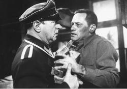 Sgt. Schulz (Sig Ruman) and Sgt. Sefton (William Holden) in Stalag 17