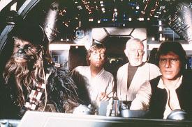 Peter Mayhew, Mark Hamill, Alec Guiness and Harrison Ford in Star Wars.