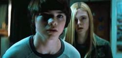 Joel Courtney and Elle Fanning having one of many dramatic conversations in Super 8. Joel Courtney and Elle Fanning having one of many dramatic conversations in Super 8.