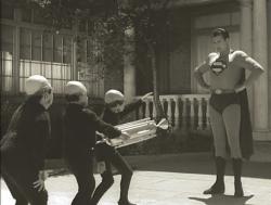 John T. Bambury, Tony Boris, Billy Curtis, and George Reeves in Superman and the Mole Men.