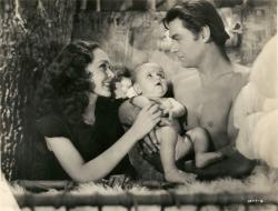 Maureen O'Sullivan, Johnny Weissmuller and baby makes three in Tarzan Finds a Son. Maureen O'Sullivan, Johnny Weissmuller and baby makes three in Tarzan Finds a Son.