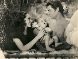 Maureen O'Sullivan, Johnny Weissmuller and baby makes three in Tarzan Finds a Son.