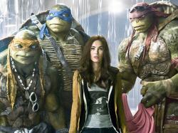 Megan Fox and some CGI covered actors in Teenage Mutant Ninja Turtles