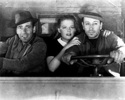 Humphrey Bogart, Ann Sheridan and George Raft drive by night. Humphrey Bogart, Ann Sheridan and George Raft drive by night.