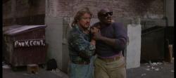 Roddy Piper and Keith David share a moment in They Live