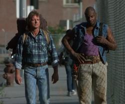 Roddy Piper and Keith David in They Live.