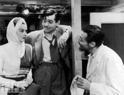 Rosalind Russell, Clark Gable and Peter Lorre in They Met in Bombay.