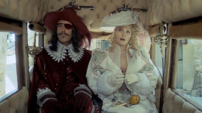 Christopher Lee and Faye Dunaway in The Three Musketeers. Christopher Lee and Faye Dunaway in The Three Musketeers.